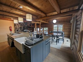 Premium Cabin | Private kitchen | Fridge, coffee/tea maker, highchair, dining tables