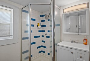 Shower, hair dryer, towels, soap