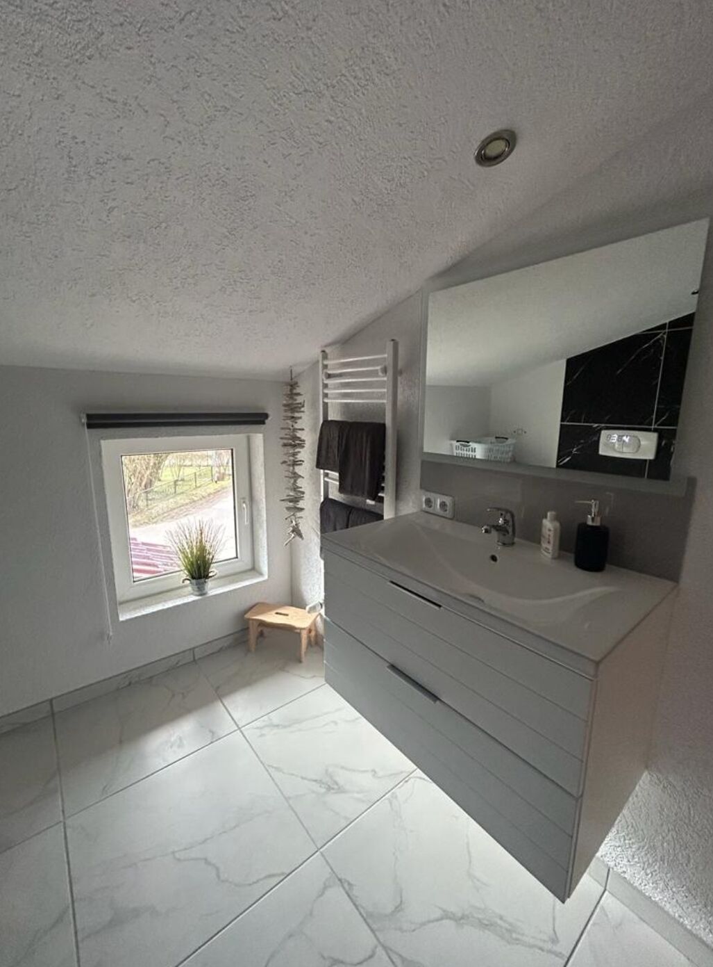 Shower, hair dryer, towels, toilet paper