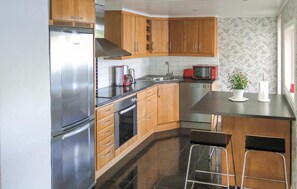 Fridge, stovetop, dishwasher, coffee/tea maker