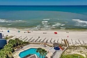 A beach resort with a swimming pool, sun loungers, and umbrellas. - 2 Bedroom, 2.5 Bath in Beach Community - Sleeps 6 (Port St. Joe)
