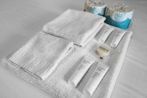 Bathtub, hair dryer, towels