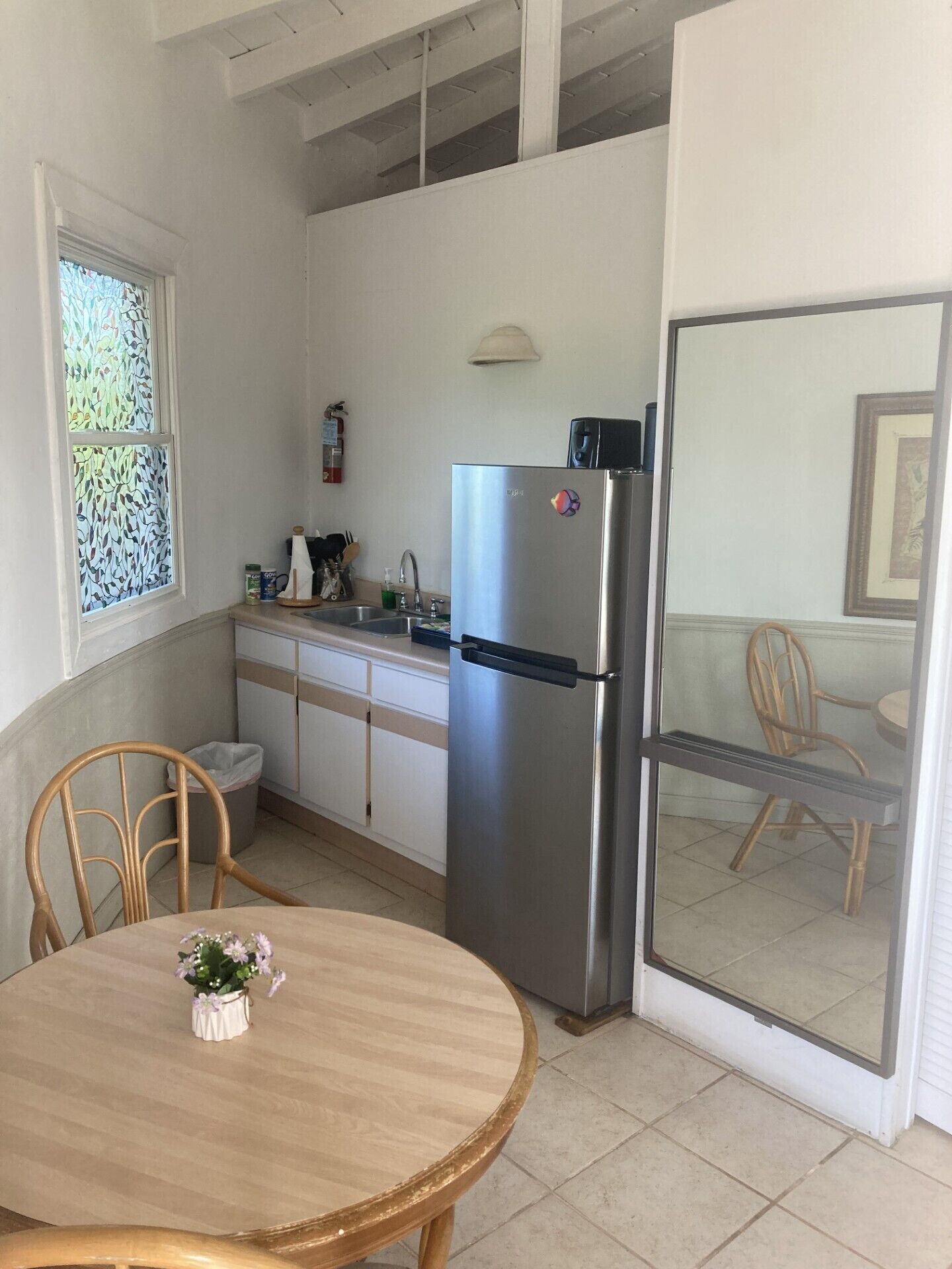 Full-sized fridge, stovetop, cookware/dishes/utensils, cleaning supplies