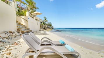 On the beach, sun-loungers, beach towels