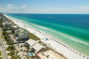 A coastal hotel with a pool, beach access, and a view of the ocean. - Timeless Traditions-Golf Cart Deals-Steps to Beach (Destin)