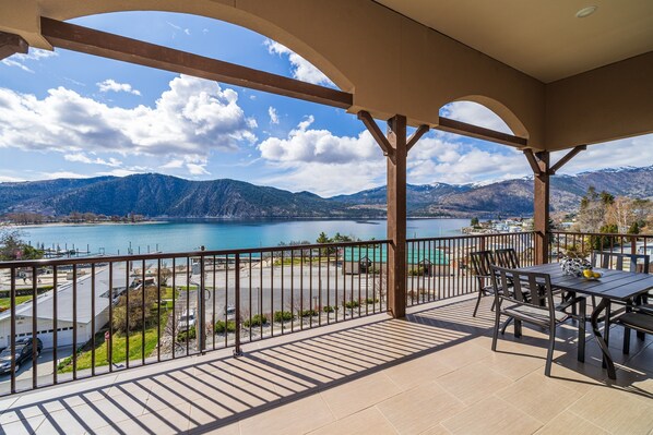 Enjoy breathtaking views of the lake and mountains from this balcony.