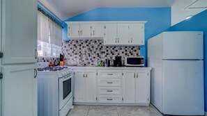 Fridge, microwave, stovetop, coffee/tea maker