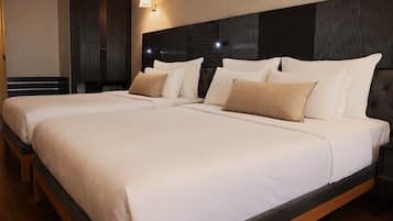 Standard Room, Multiple Beds, Non Smoking, City View | Minibar, in-room safe, laptop workspace, soundproofing