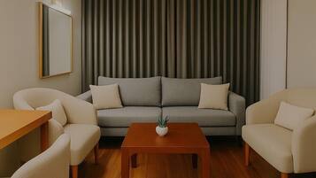 Business Suite, 1 Queen Bed, Non Smoking, City View (with Sofabed) | Living area | 52-inch Smart TV with satellite channels, TV