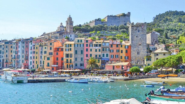 A coastal town with colorful buildings, a historic tower, and a castle on a hill. - Amazing apartment in Portovenere (Portovenere)