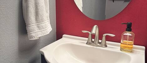 Bathtub, hair dryer, bidet, towels