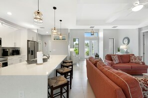 Relax in this inviting space with a comfortable sofa and armchair, perfect for unwinding.