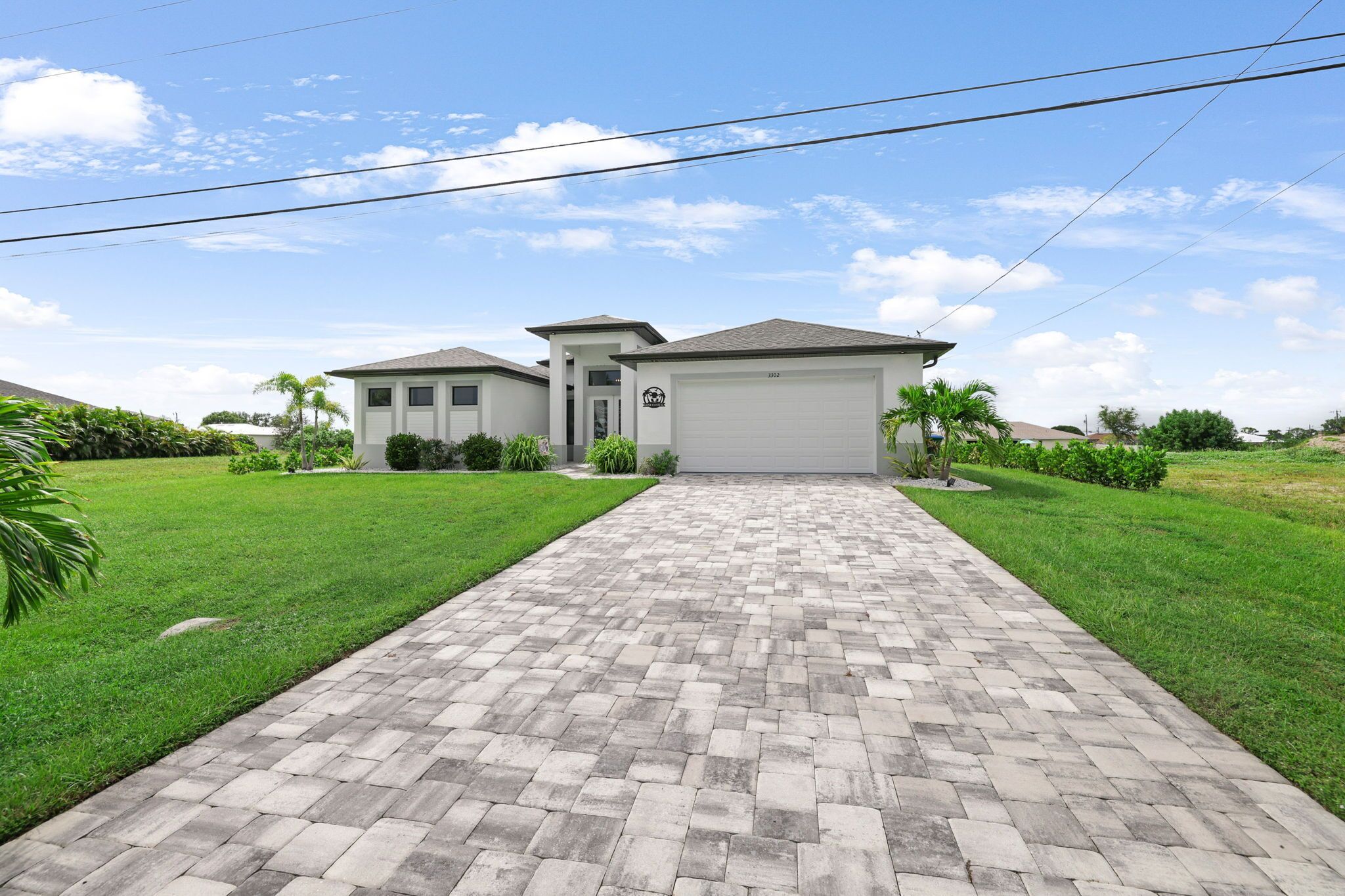 New construction waterfront home with heated salt water pool