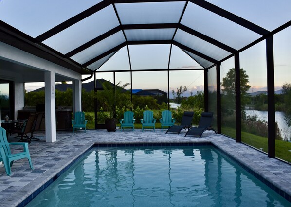 Relax by the pool surrounded by a scenic view.