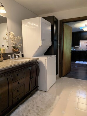 Bathtub, hair dryer, towels, soap