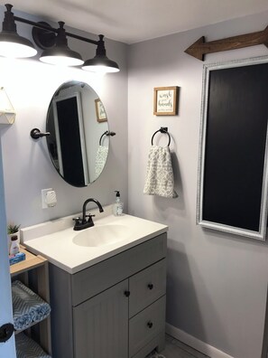 Bathtub, towels, toilet paper