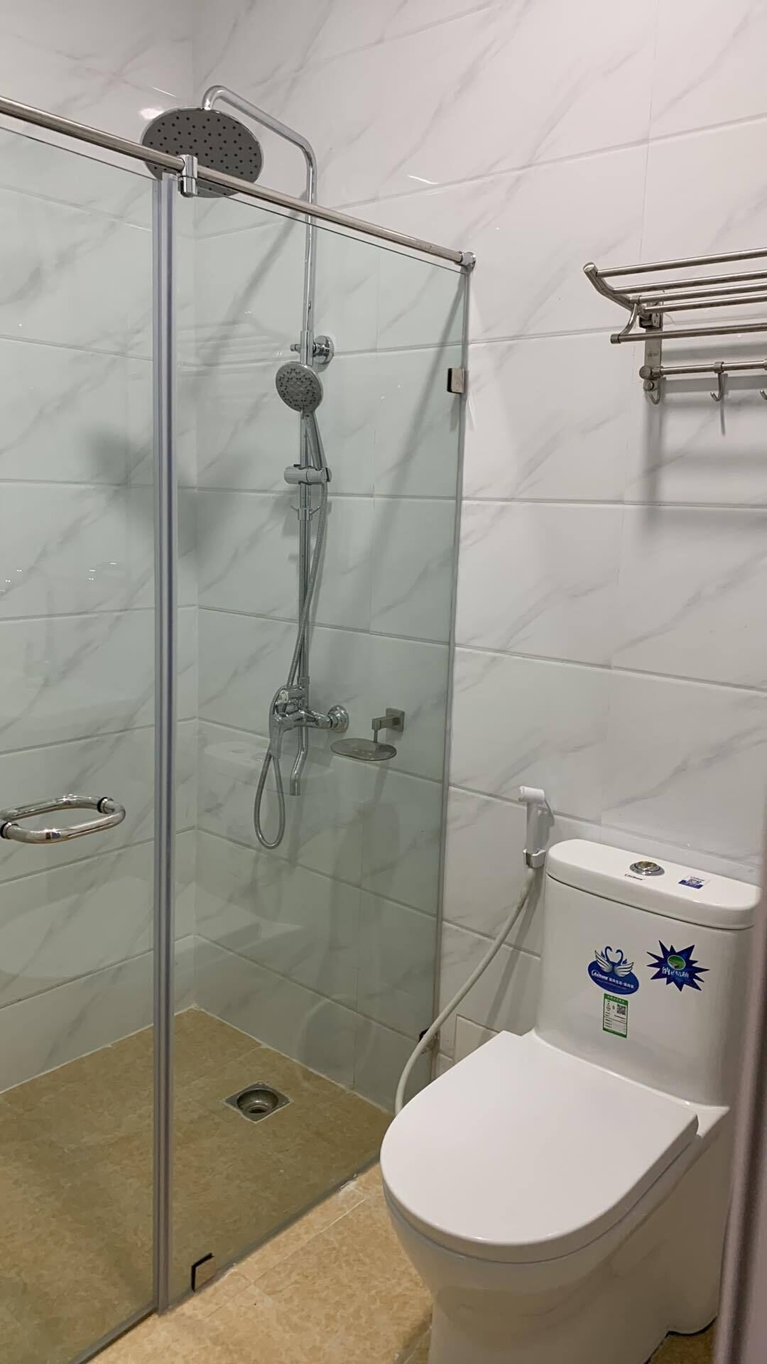 Shower, rainfall showerhead, bidet, towels