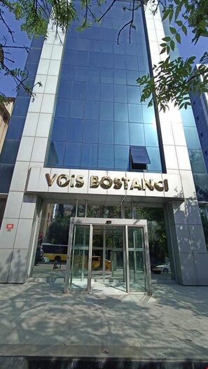 A modern building with a glass facade and the sign 'VOIS BOSTANCI' above the entrance. - Vois Hotel Bostancı (Istanbul)