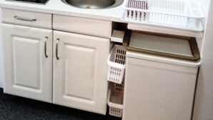 A kitchen with a sink, two cabinets, a countertop, and a glass shelf above. - Near Lake, With View, Center (Ohrid)