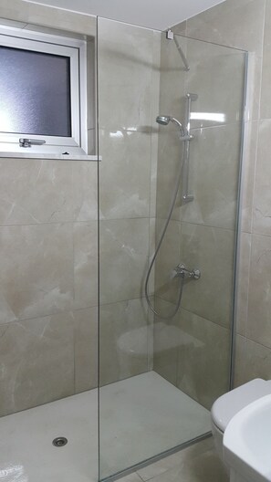 Shower, hair dryer, towels, soap