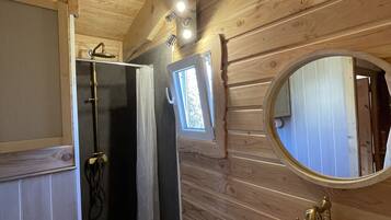 Shower, hair dryer, soap, toilet paper