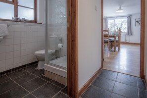 Separate bathtub and shower, towels