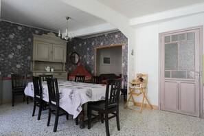 Enjoy family meals and casual gatherings in this classic dining room with a long table and comfortable seating for six.