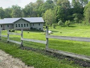 Front of house, spacious yard.