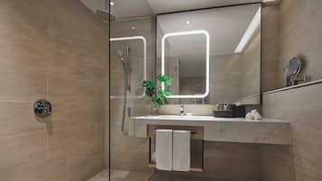 A modern bathroom with a glass shower enclosure, a marble sink, and a large mirror with integrated lighting.