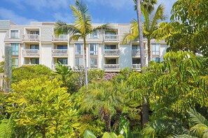 Exterior - Garden Oasis with a Glimpse of the Ocean – Cozy 1-Bedroom Condo (Oceanside)