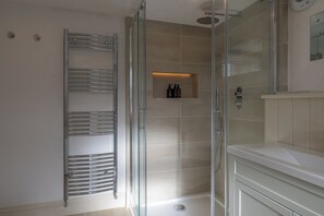 Bathtub, eco-friendly toiletries, hair dryer, towels