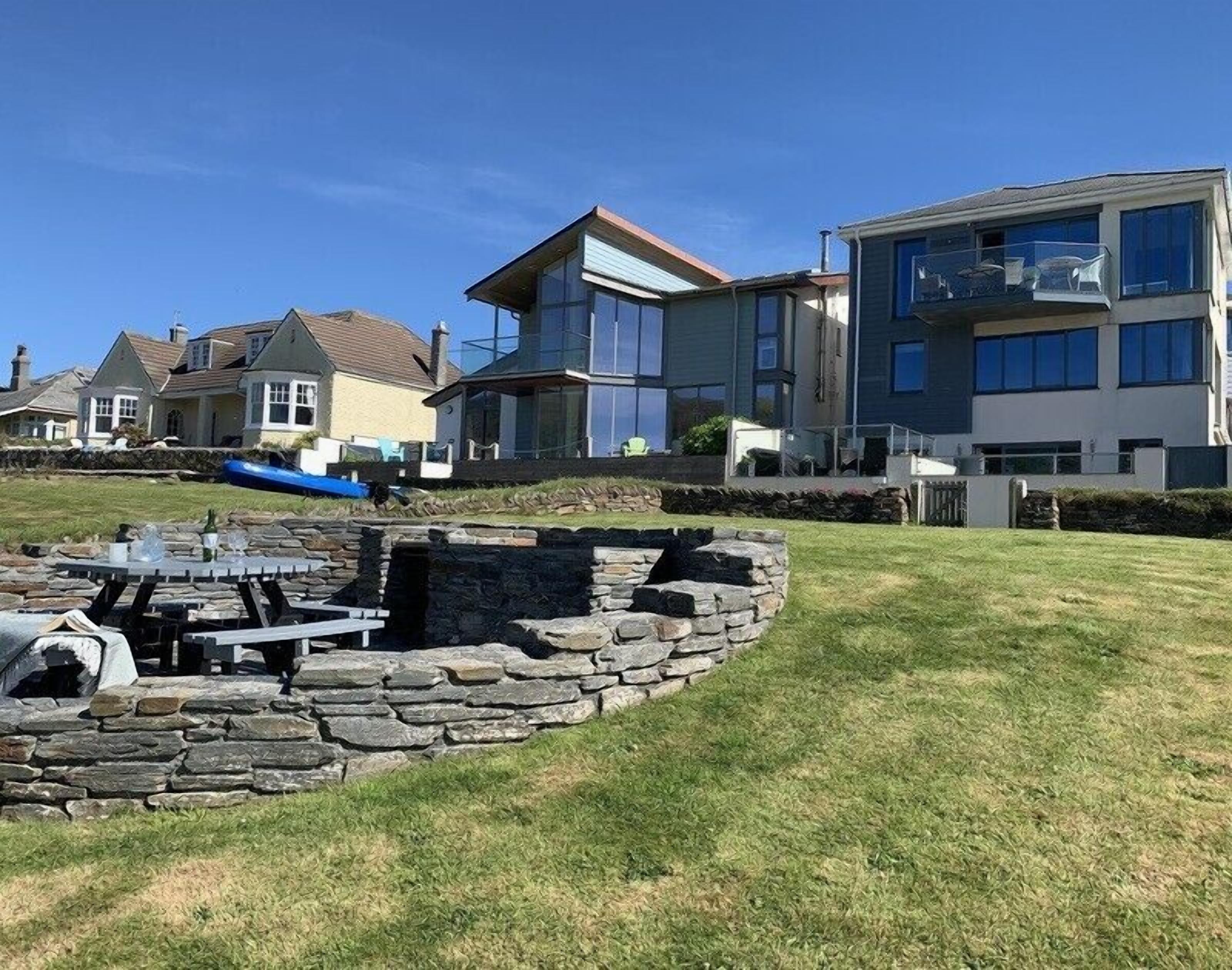 A modern residential area with stone structures and houses.