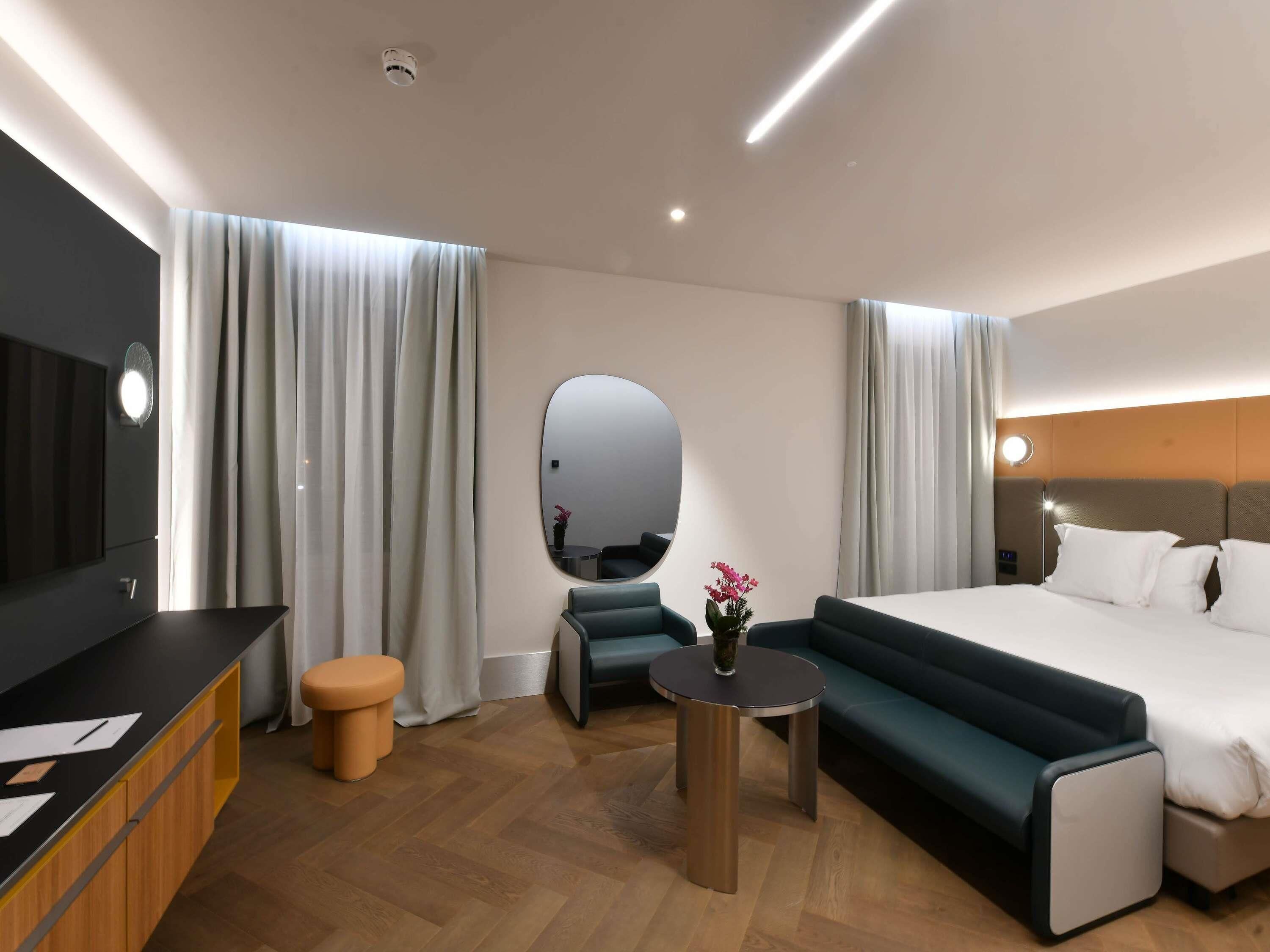 Habitación Deluxe | Ropa de cama de alta calidad y edredones de plumas