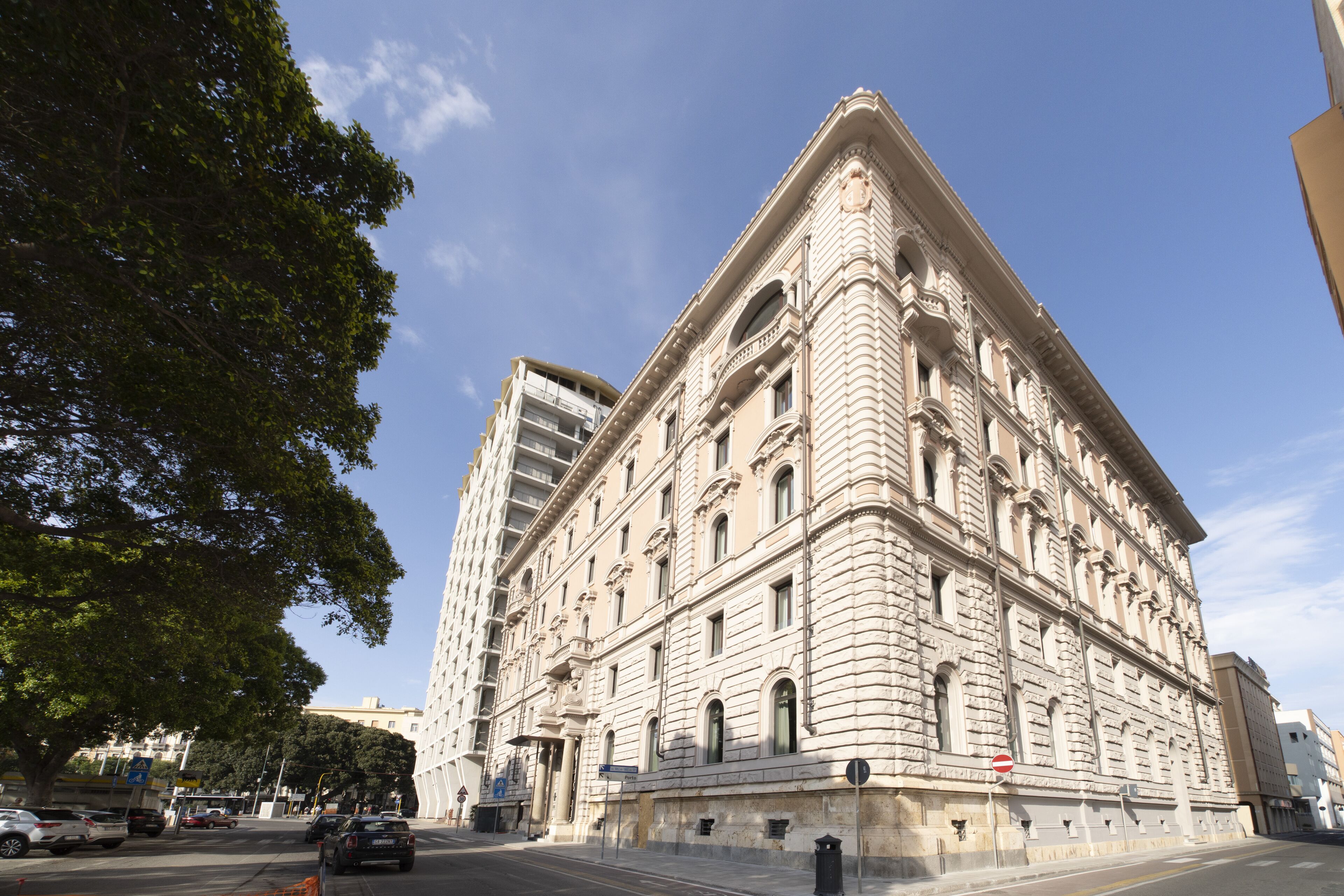 A large, historic building with classical architecture, featuring multiple stories and ornate detailing.