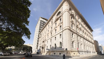 A large, historic building with classical architecture, featuring multiple stories and ornate detailing.