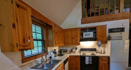 Cozy cabin with wrap around porch and only minutes to town!