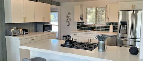 Rumah, beberapa kamar | Dapur pribadi | Lemari es, oven, mesin pembuat kopi/teh, dan pemanggang roti