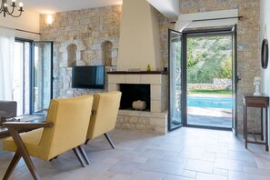 Villa Sparti | Living area | 25-inch flat-screen TV with cable channels, TV
