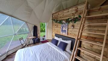 Deluxe Tent | Premium bedding, down comforters, individually decorated