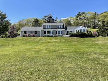 Photo of the main house with sprawling lawn
