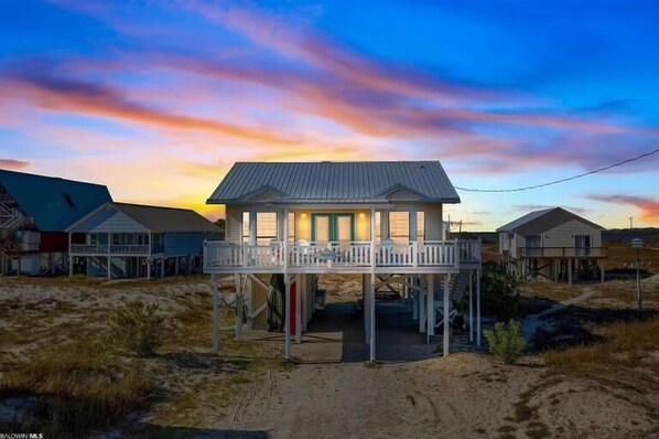 A beachfront house with a balcony, elevated structure, and a view of the ocean. - Stunning Beach Views, Dogs Welcome/Family Friendly! (Gulf Shores)