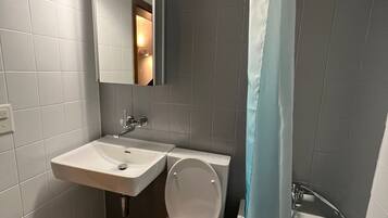 Bathtub, hair dryer, towels, soap