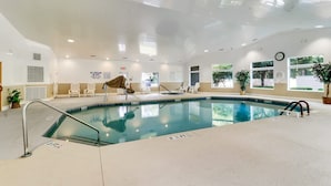 An indoor swimming pool with clear water, a lifeguard chair, and a sign indicating no lifeguard on duty. - Port Royal Sound 2BR Villa Balcony, Pools & Beach Access (Hilton Head Island)