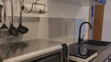 Fridge, coffee/tea maker, electric kettle, toaster