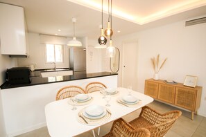 A modern kitchen with a dining area. - Riviera del Sol, walking distance to the beach (Mijas Costa)