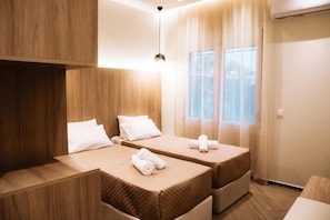 Familie appartement, 2 slaapkamers | Luxe beddengoed, bedden met traagschuimmatras, geluiddichte muren