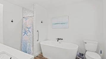 Bathtub, hair dryer, towels, soap