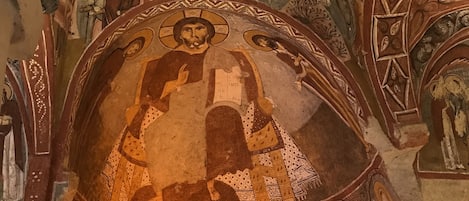 A detailed mosaic with religious figures and architectural elements.