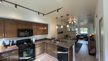 Coffee/tea maker, fridge, microwave, oven