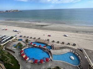 On the beach, sun-loungers, beach towels
